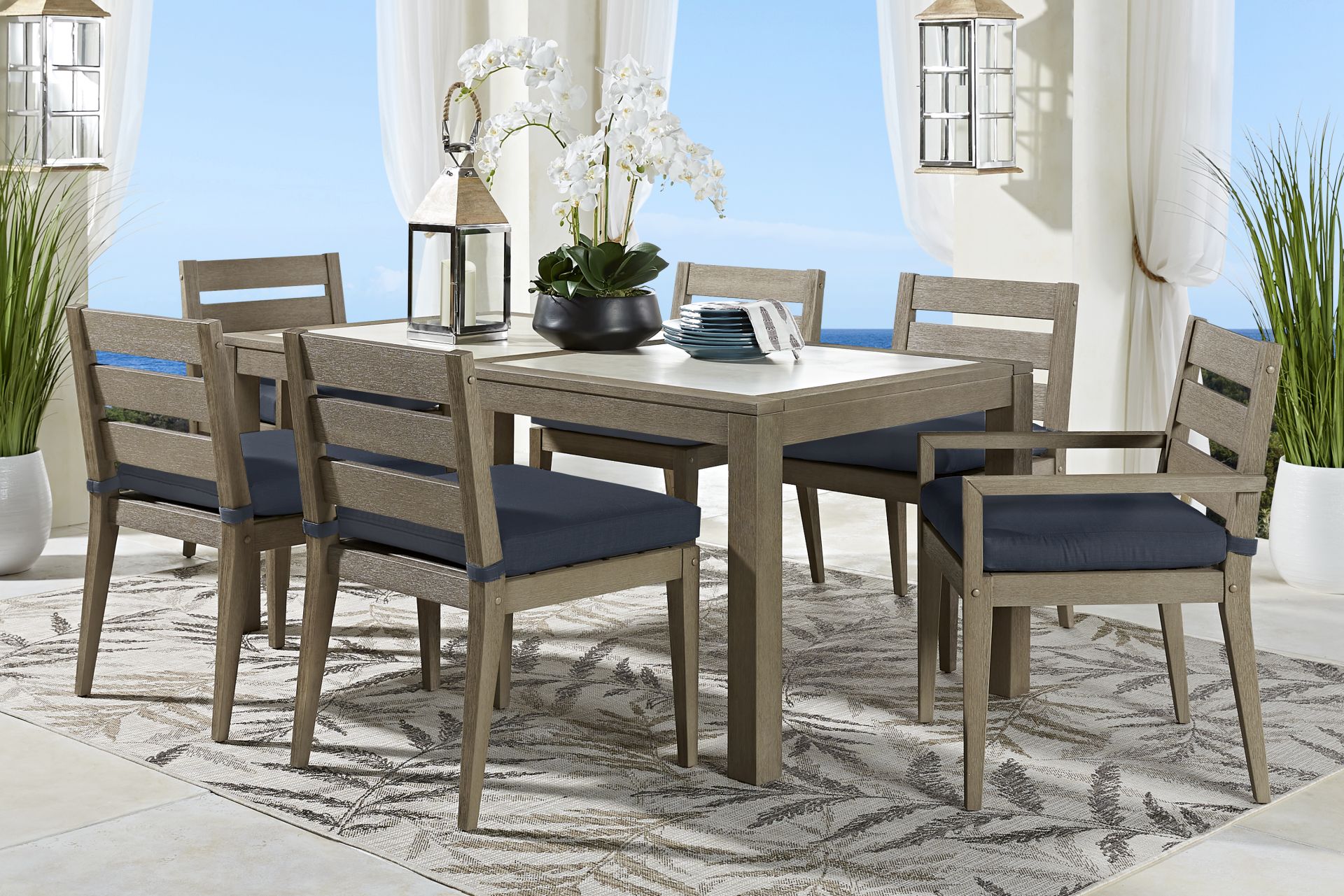 Lake Tahoe Gray 7 Pc Rectangle Outdoor Dining Set with Indigo Cushions - Image 1