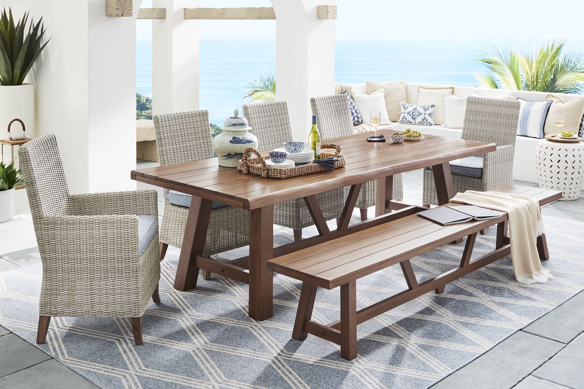 Patmos Tan 7 Pc 102 in. Rectangle Outdoor Dining Set With Steel Cushions and Bench - Image 1