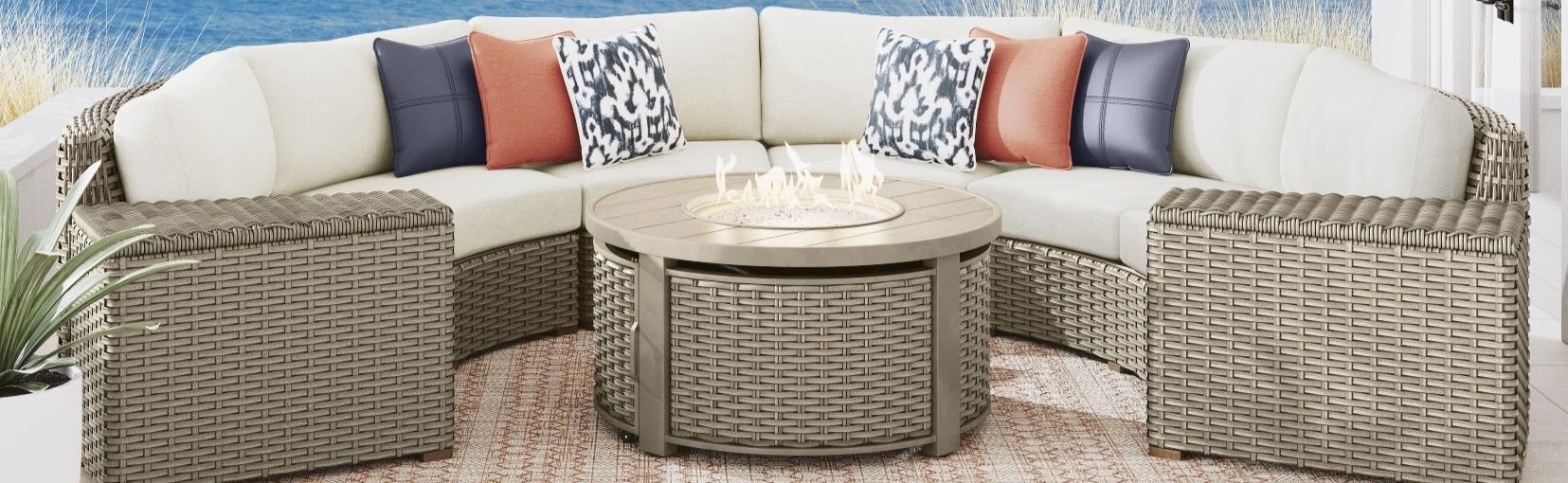 Outdoor sectional sofa with a fire pit table and storage ottomans.
