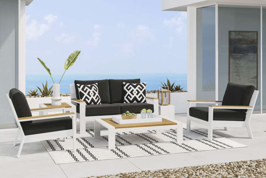 Outdoor patio furniture set with a sofa, two armchairs, and a coffee table.