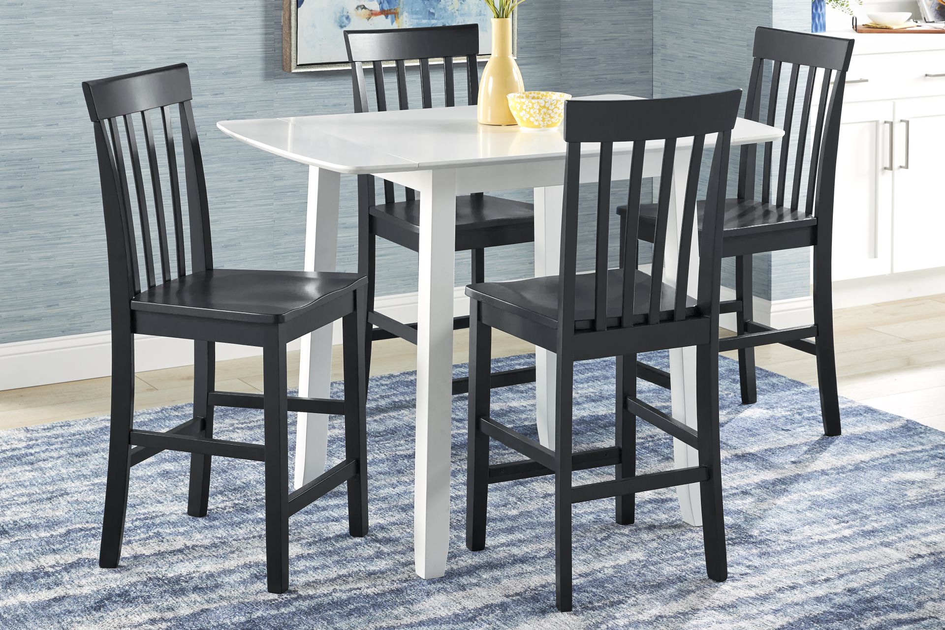 Concord White 5 Pc Counter Height Drop Leaf Dining Room with Black Slat Back Stools - Image 1