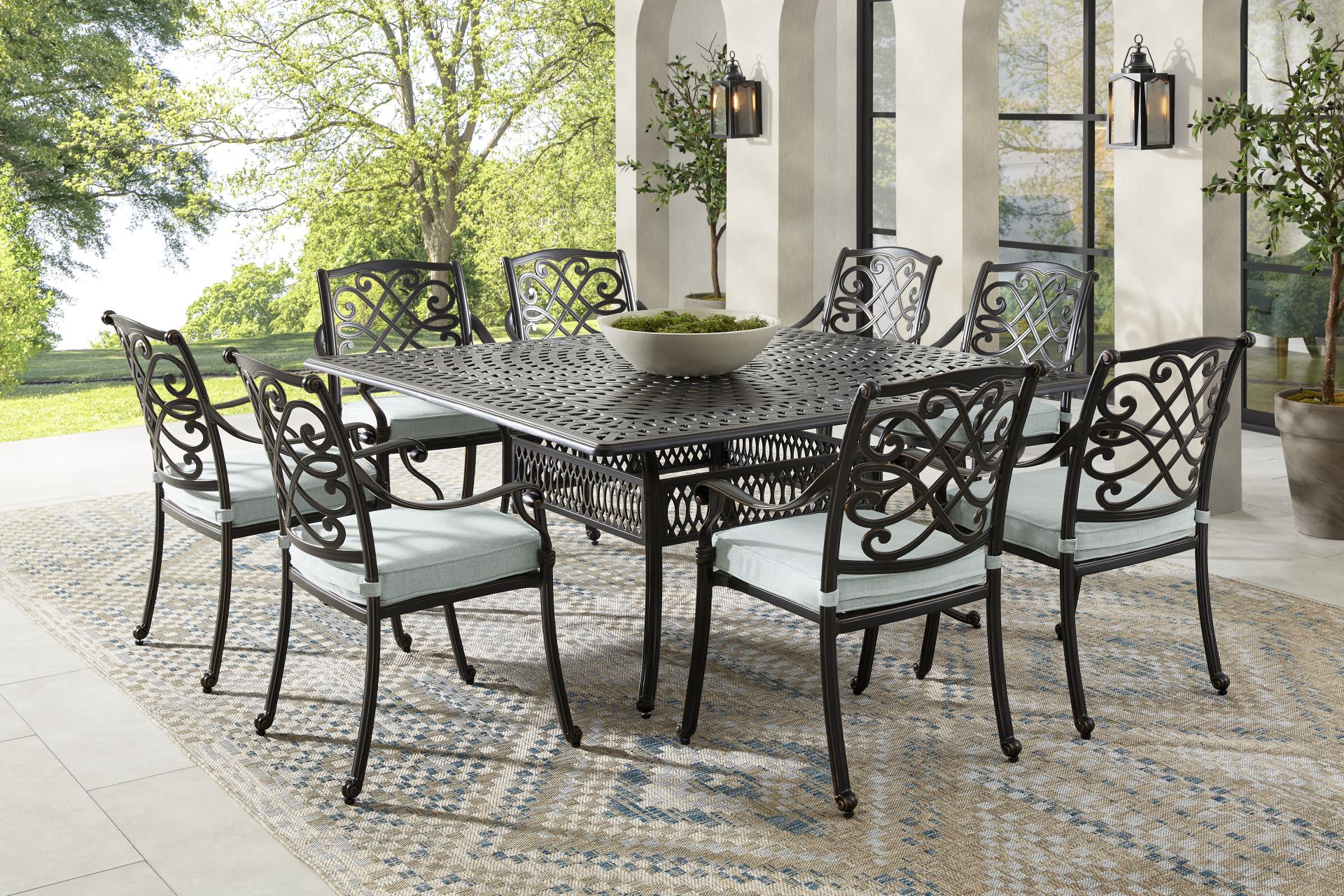 Carina Bronze 9 Pc Square Outdoor Dining Set with Sky Cushions - Image 1