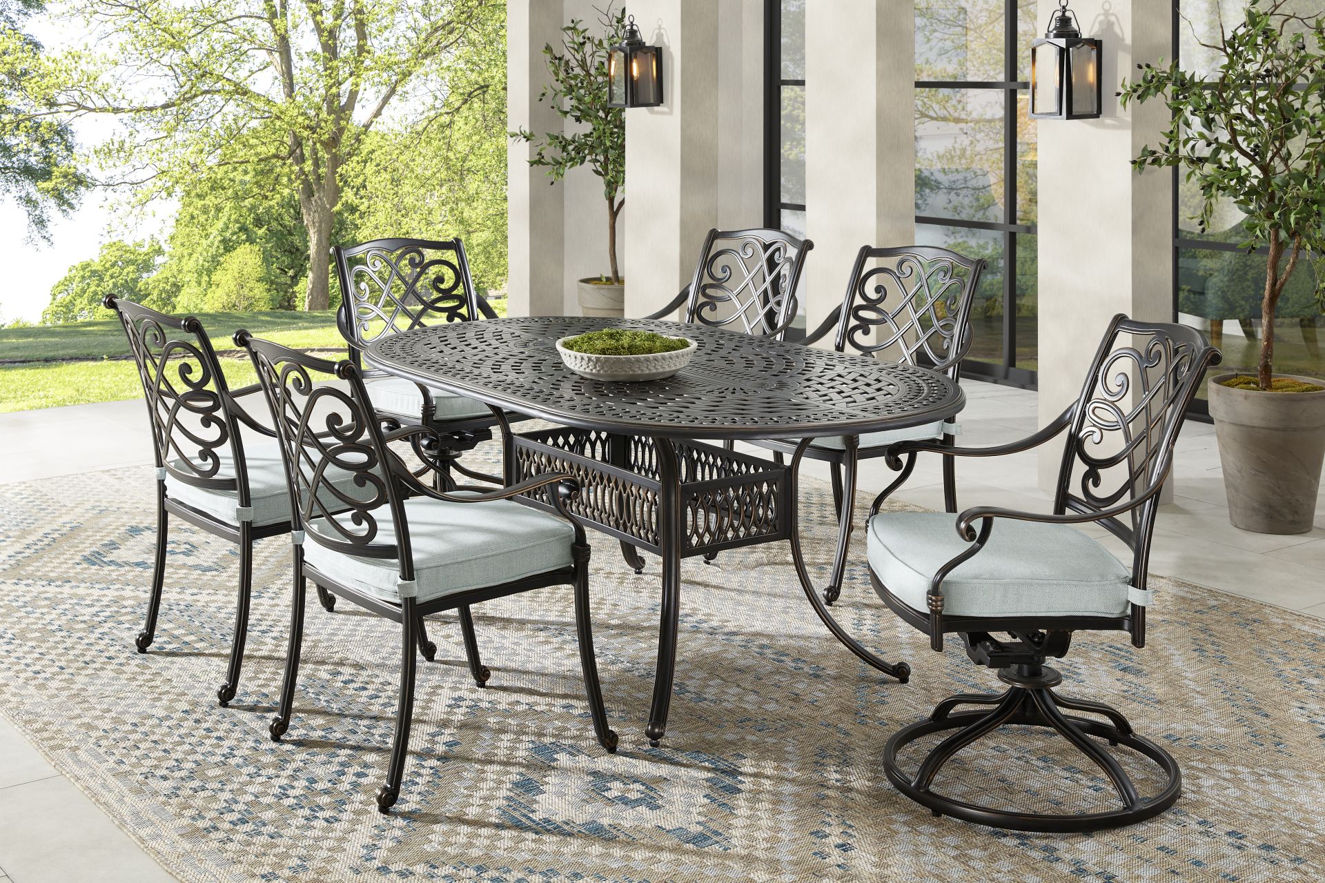 Carina Bronze 7 Pc Oval Outdoor Dining Set with Sky Cushions - Image 1