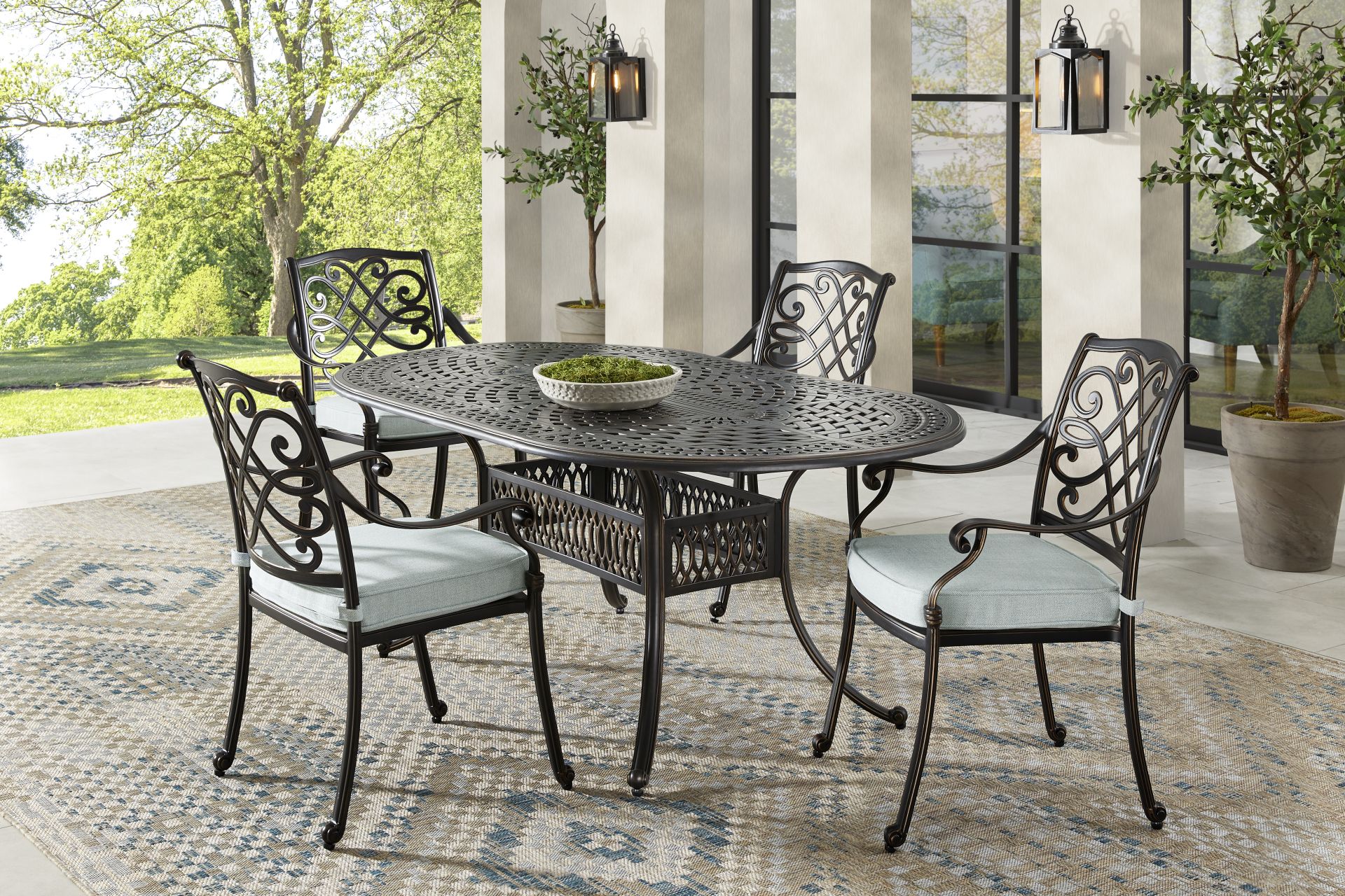 Carina Bronze 5 Pc Oval Outdoor Dining Set with Sky Cushions - Image 1