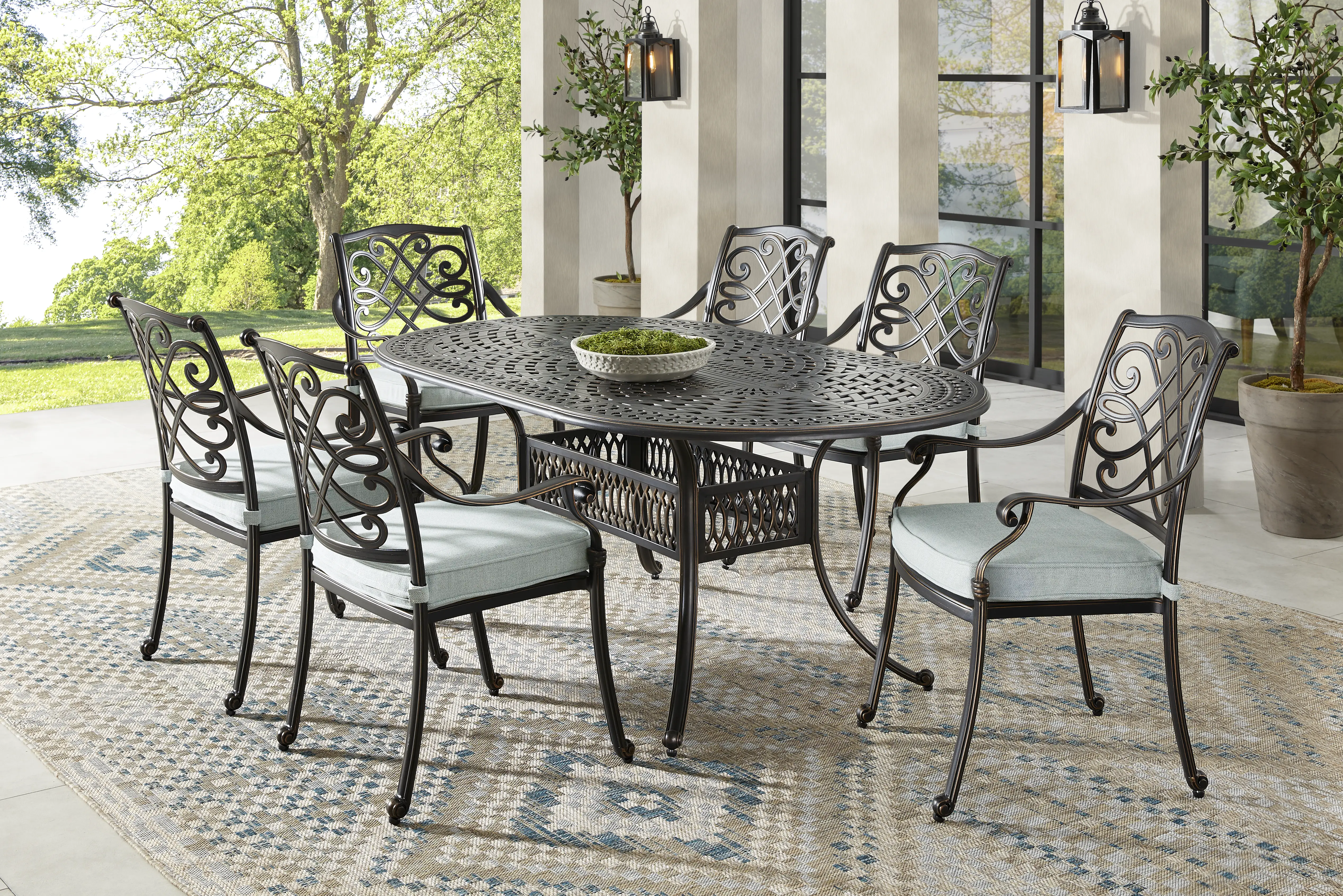 Carina Bronze 7 Pc Oval Outdoor Dining Set with Sky Cushions - Thumbnail - Image 1