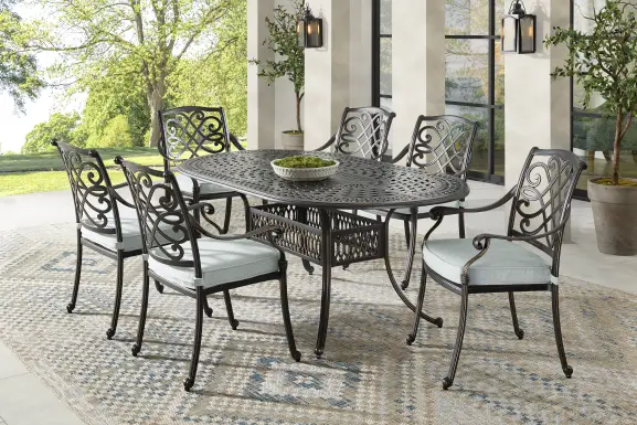 Carina Bronze 7 Pc Oval Outdoor Dining Set with Sky Cushions