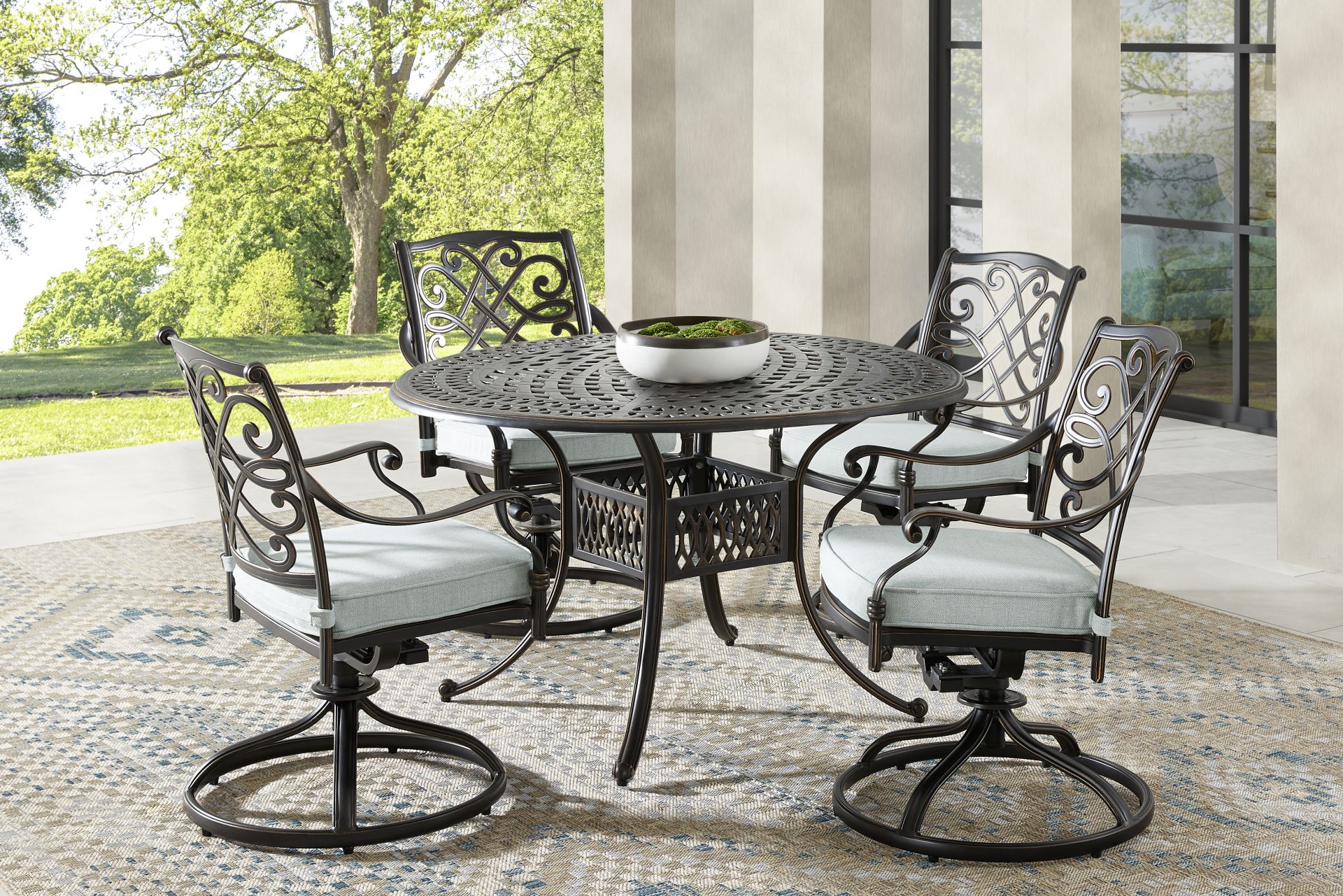 Carina Bronze 5 Pc 48 in. Round Outdoor Dining Set with Sky Cushions - Image 1