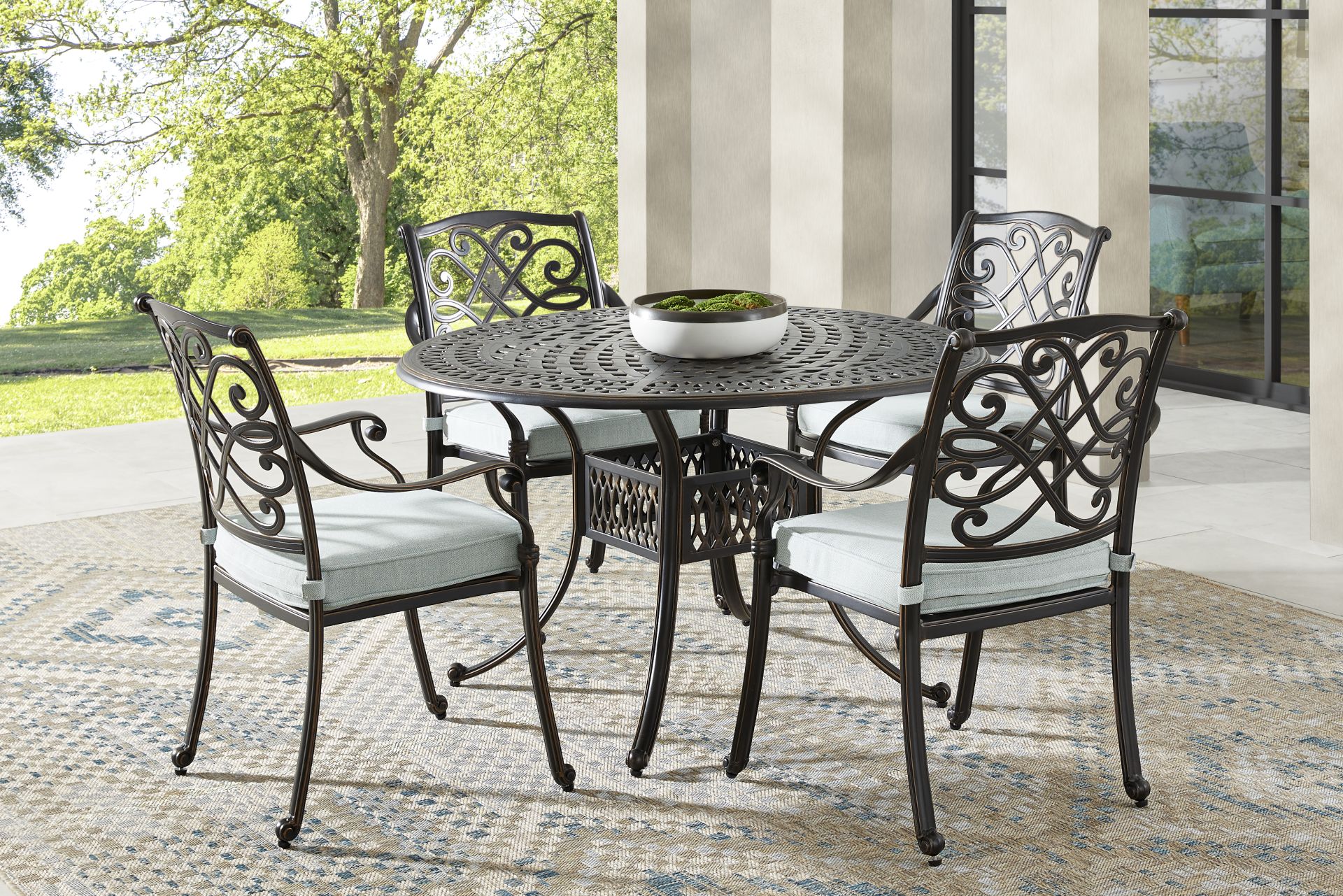 Carina Bronze 5 Pc 48 in. Round Outdoor Dining Set with Sky Cushions - Image 1