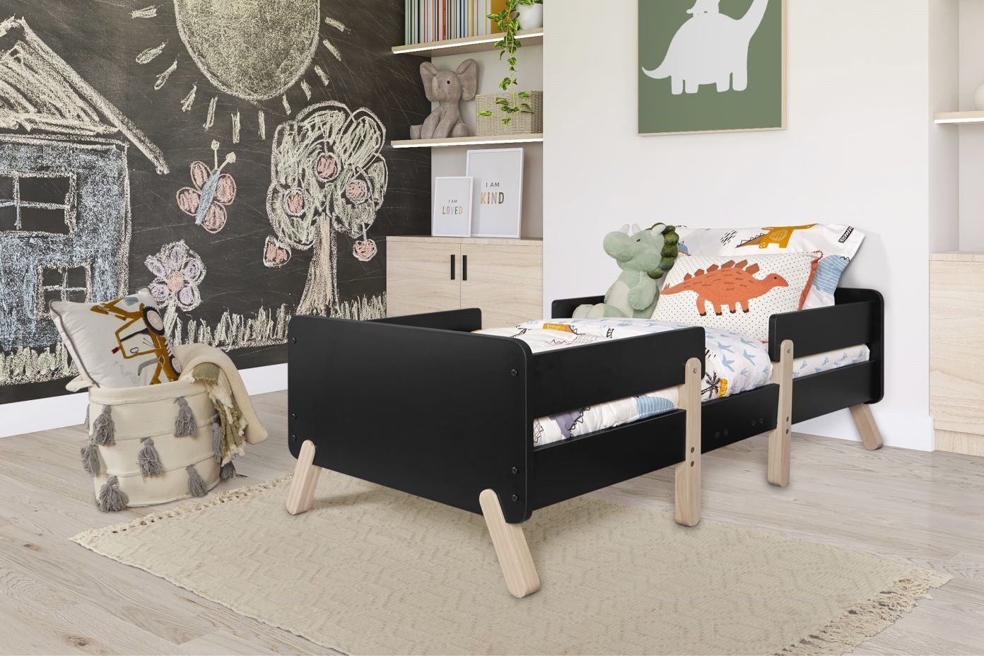 Black toddler bed with light wood legs.
