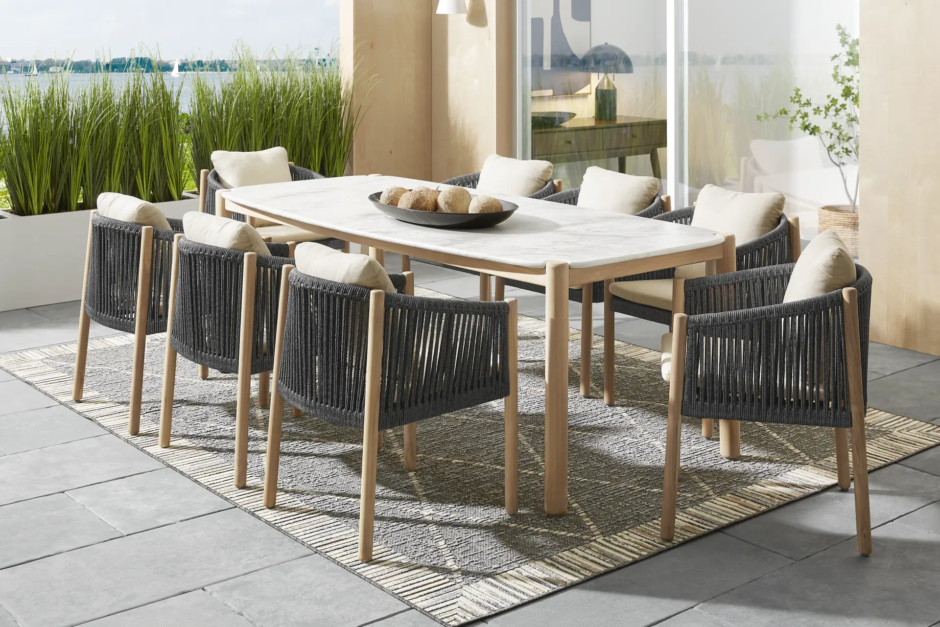 Koda Natural 9 Pc Outdoor Dining Set with Charcoal Arm Chairs