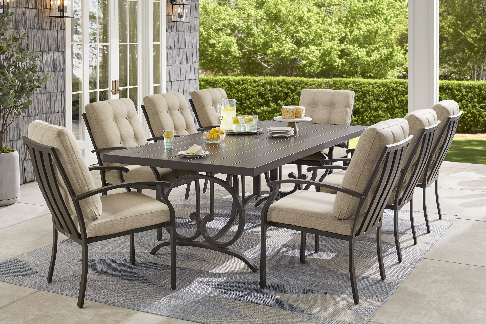 Lake Breeze Aged Bronze 9 Pc Outdoor Dining Set with Hemp-Colored Cushions - Image 1