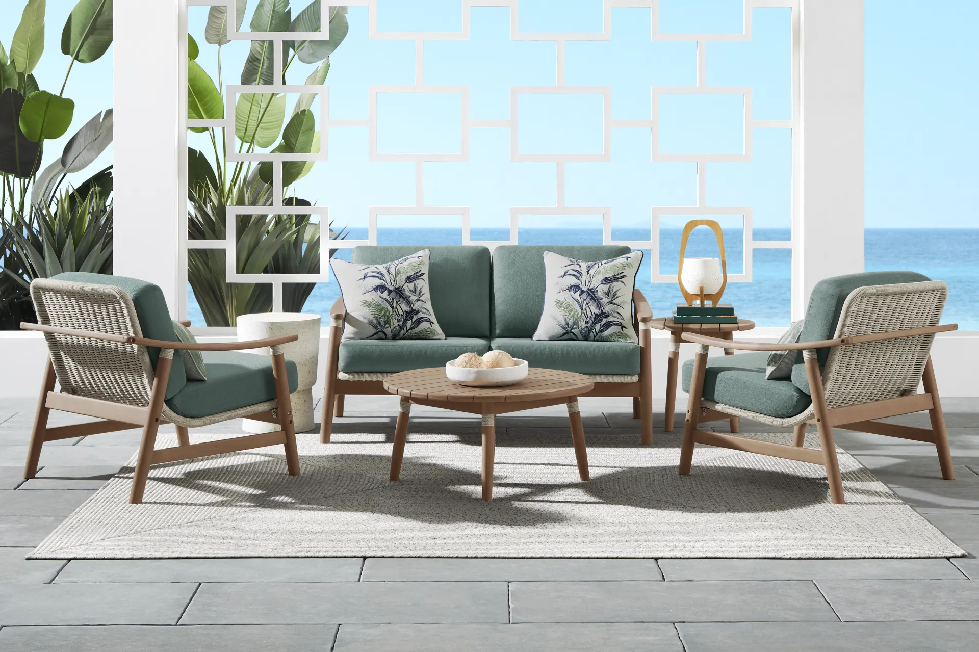 Raphina Gray Outdoor Loveseat with Jungle Cushions - Image 1