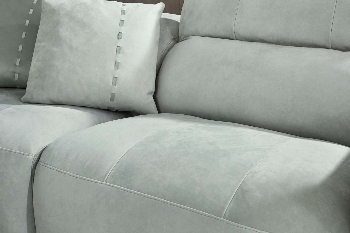 Light gray sofa with pillows.