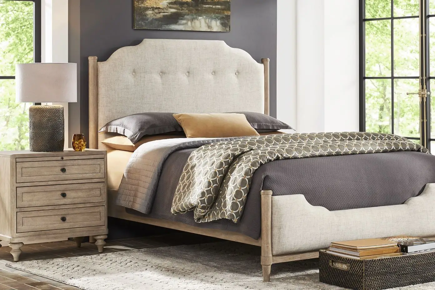Bedroom with a bed, nightstand, and lamp.
