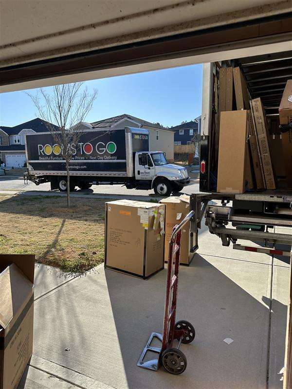 Rooms To Go truck delivering furniture.