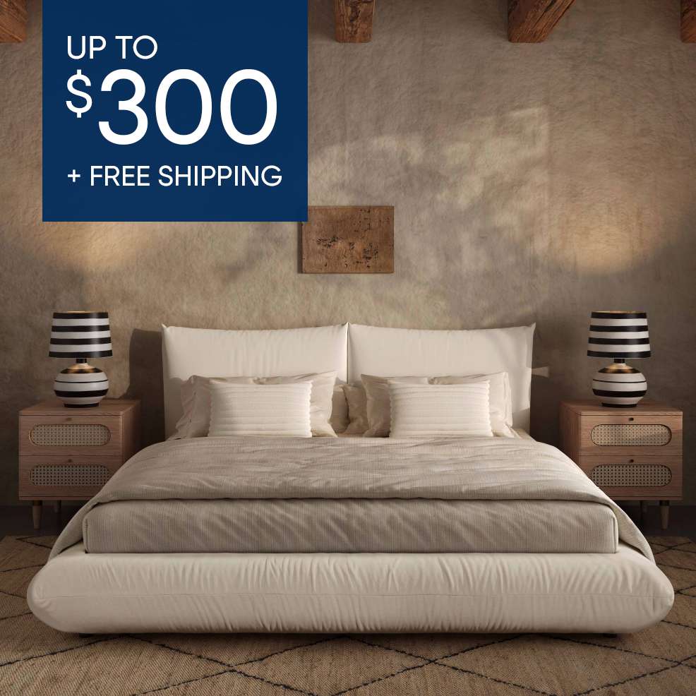 Up to $300 + Free Shipping. A bed with two nightstands and lamps.
