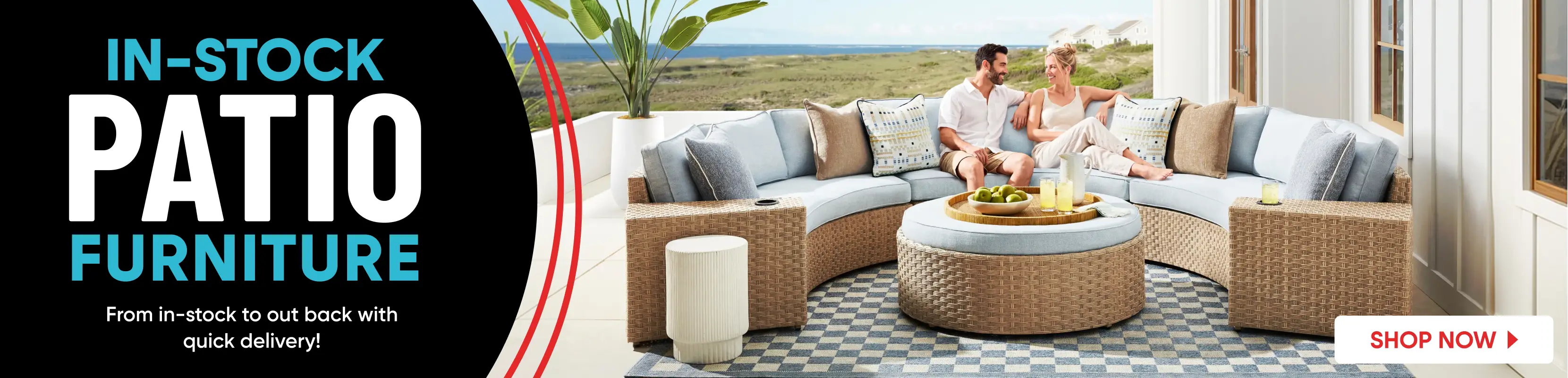 IN-STOCK PATIO FURNITURE. A couple sits on a curved wicker sectional sofa on a patio overlooking the ocean.