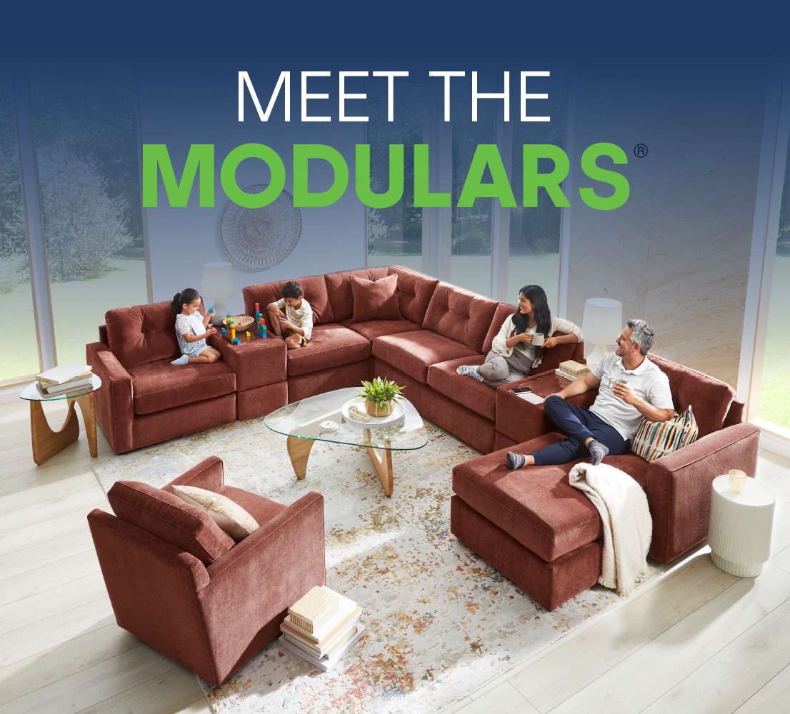 MEET THE MODULARS. A family relaxes on a modular sofa.
