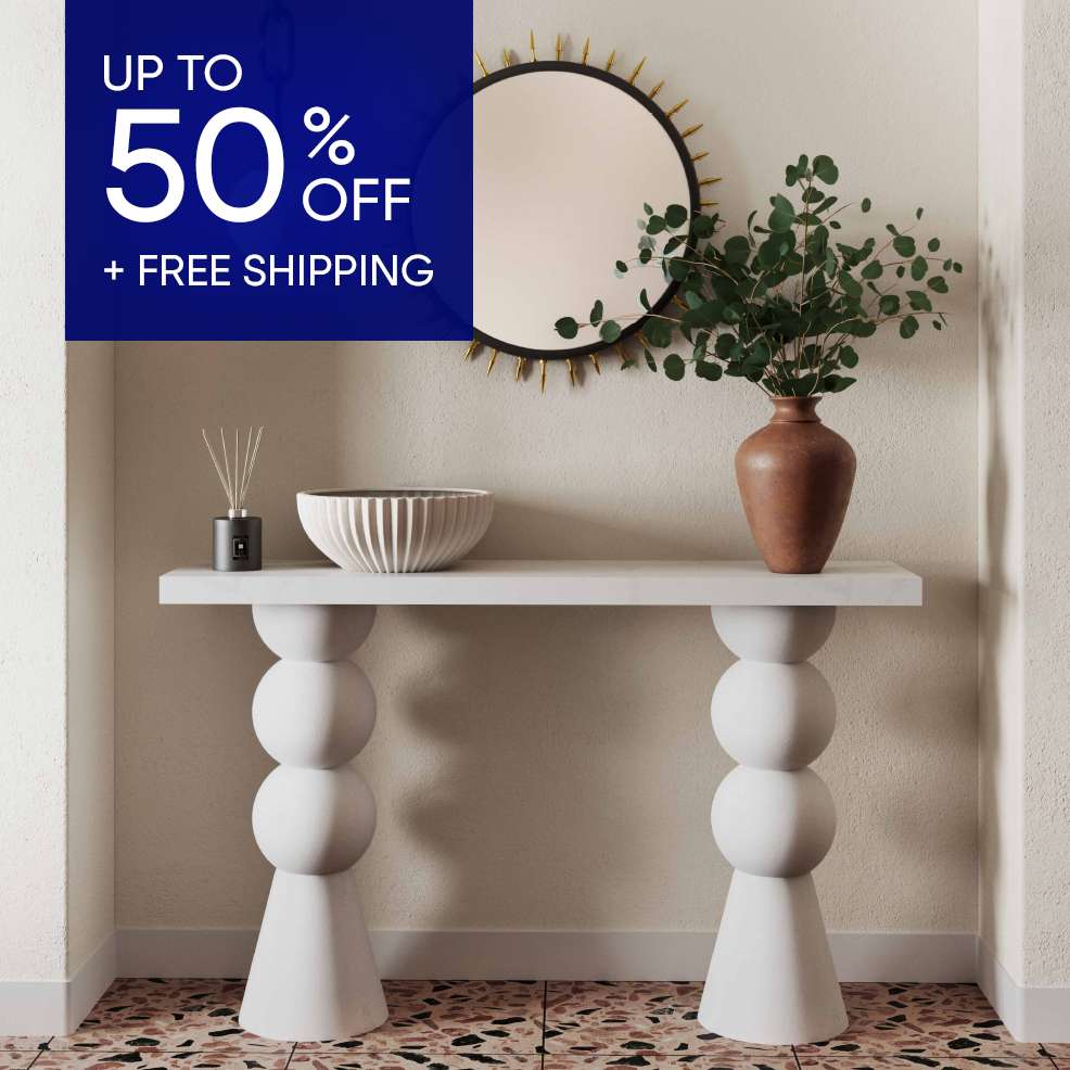 UP TO 50% OFF + FREE SHIPPING. A white console table with decorative items.

