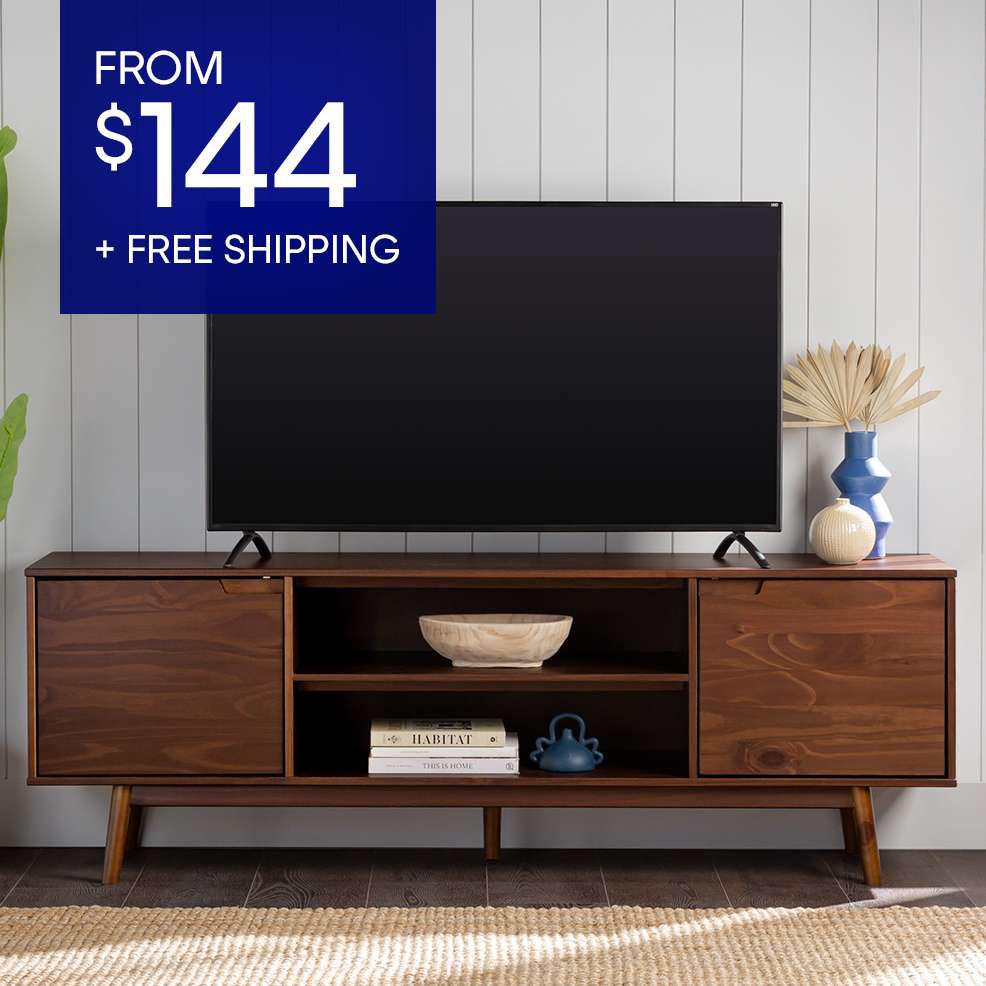 FROM $144 + FREE SHIPPING. A brown mid-century modern TV stand with a TV on top.
