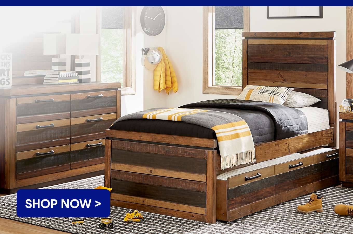 SHOP NOW > A bedroom set with a bed and dresser.
