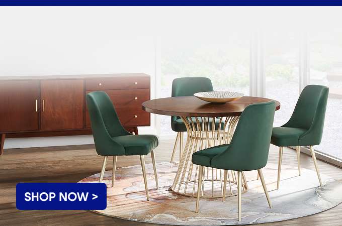 SHOP NOW > Dining room set with a round table and green chairs.
