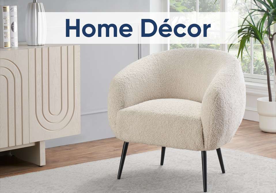 Home Décor. A cream-colored, boucle armchair with black legs.
