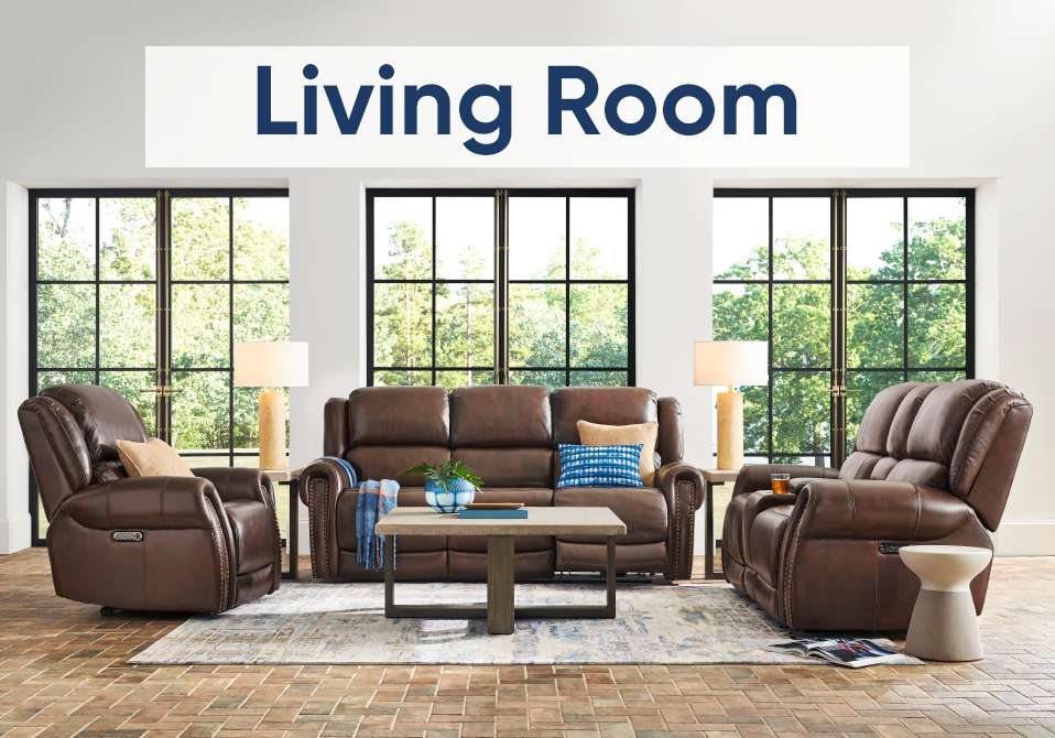 Living Room. A living room set with a brown leather sofa and recliners.
