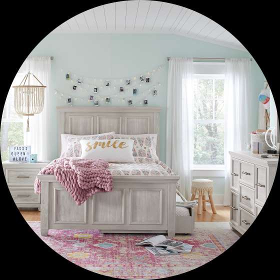 Bedroom with a bed, nightstand, dresser, and rug.

