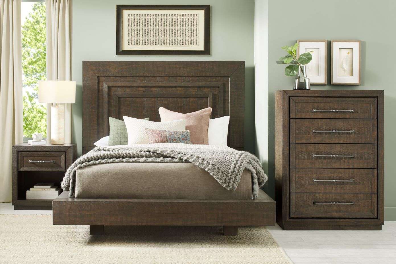Bedroom set with a bed, nightstand, and dresser.
