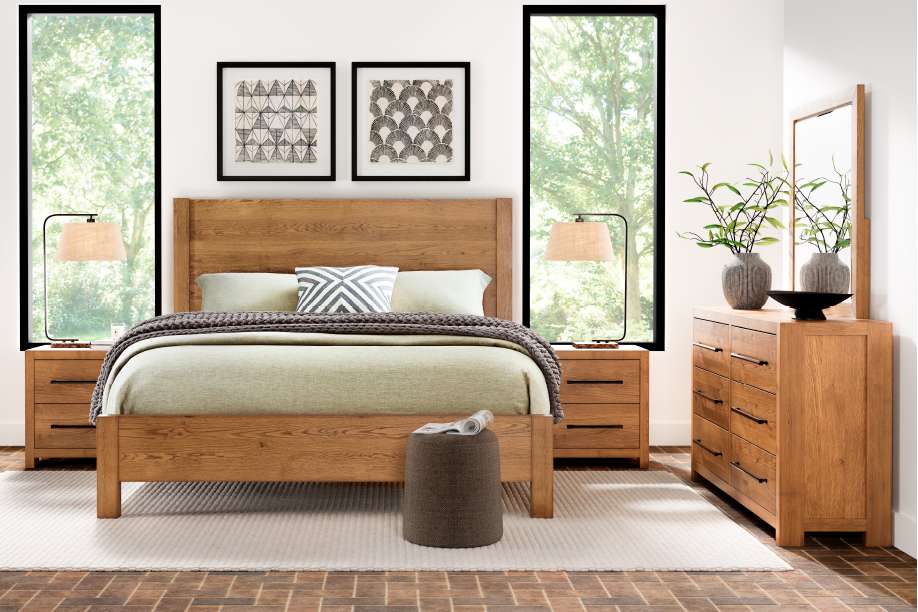 Bedroom with wooden furniture, including a bed, nightstands, and dresser.
