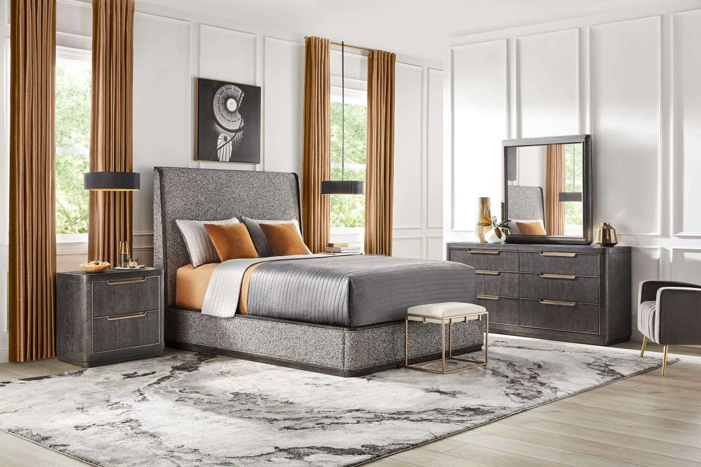 Bedroom furniture set with a bed, dresser, and nightstand.
