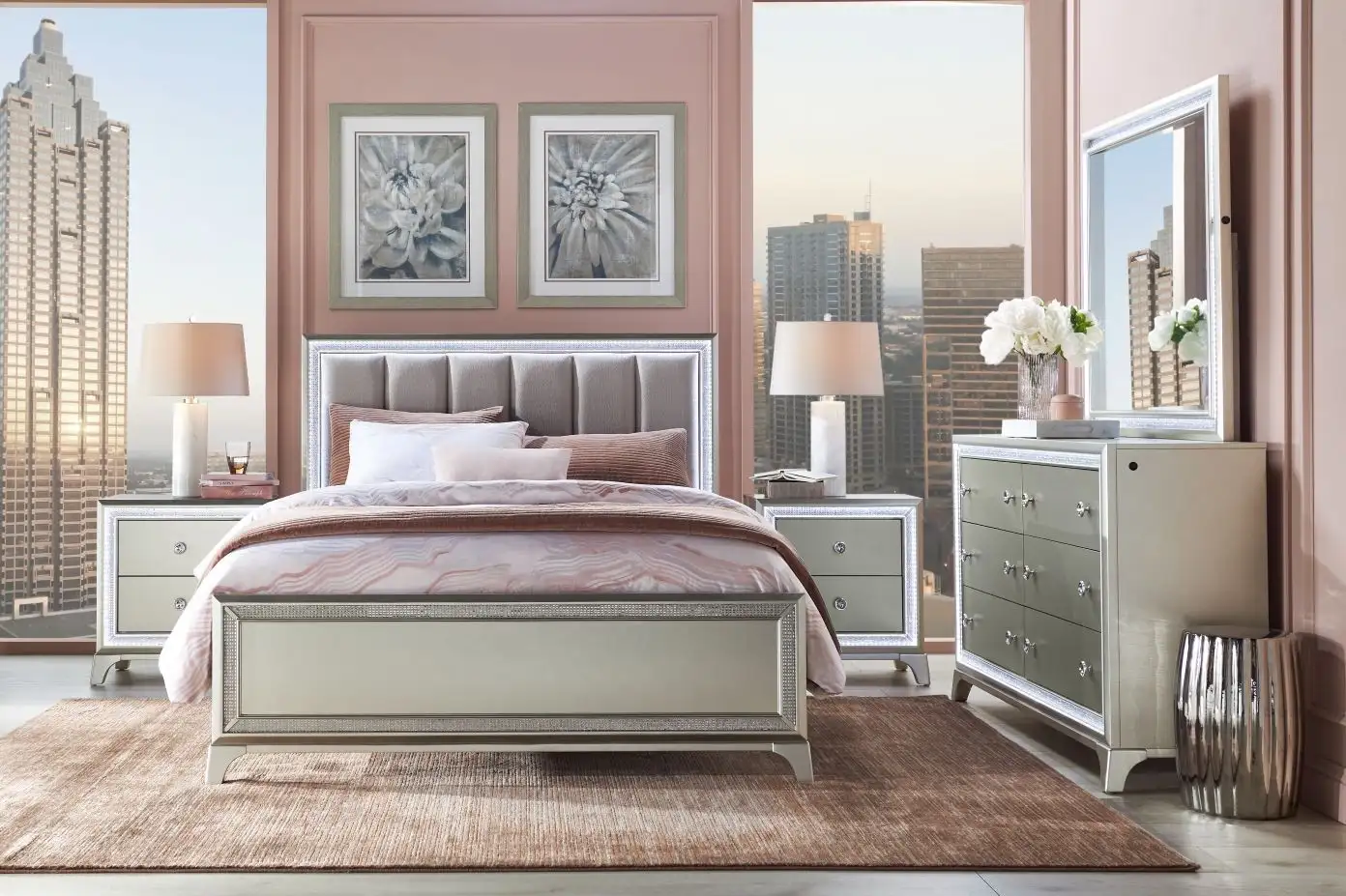 Bedroom furniture set with a bed, nightstands, dresser, and mirror.
