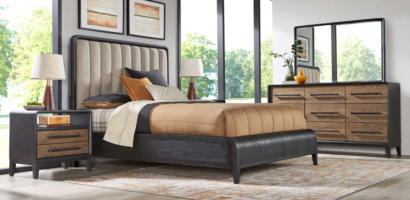Bedroom furniture set with a bed, nightstand, and dresser.
