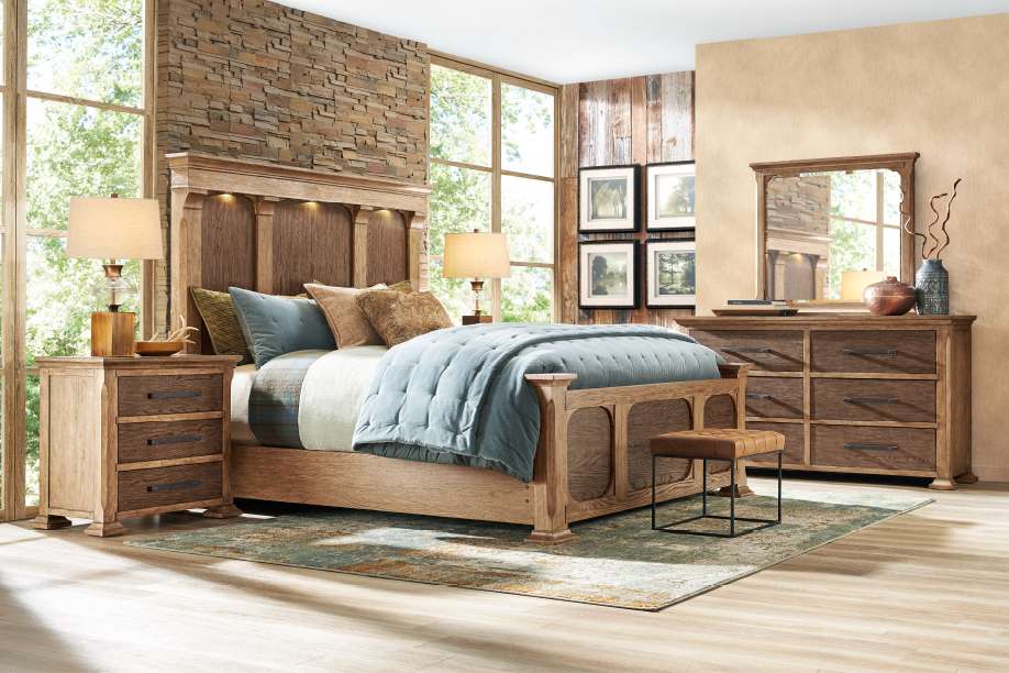 Bedroom furniture set with a bed, nightstand, dresser, and mirror.
