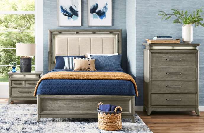 Bedroom furniture set with a bed, nightstand, and dresser.
