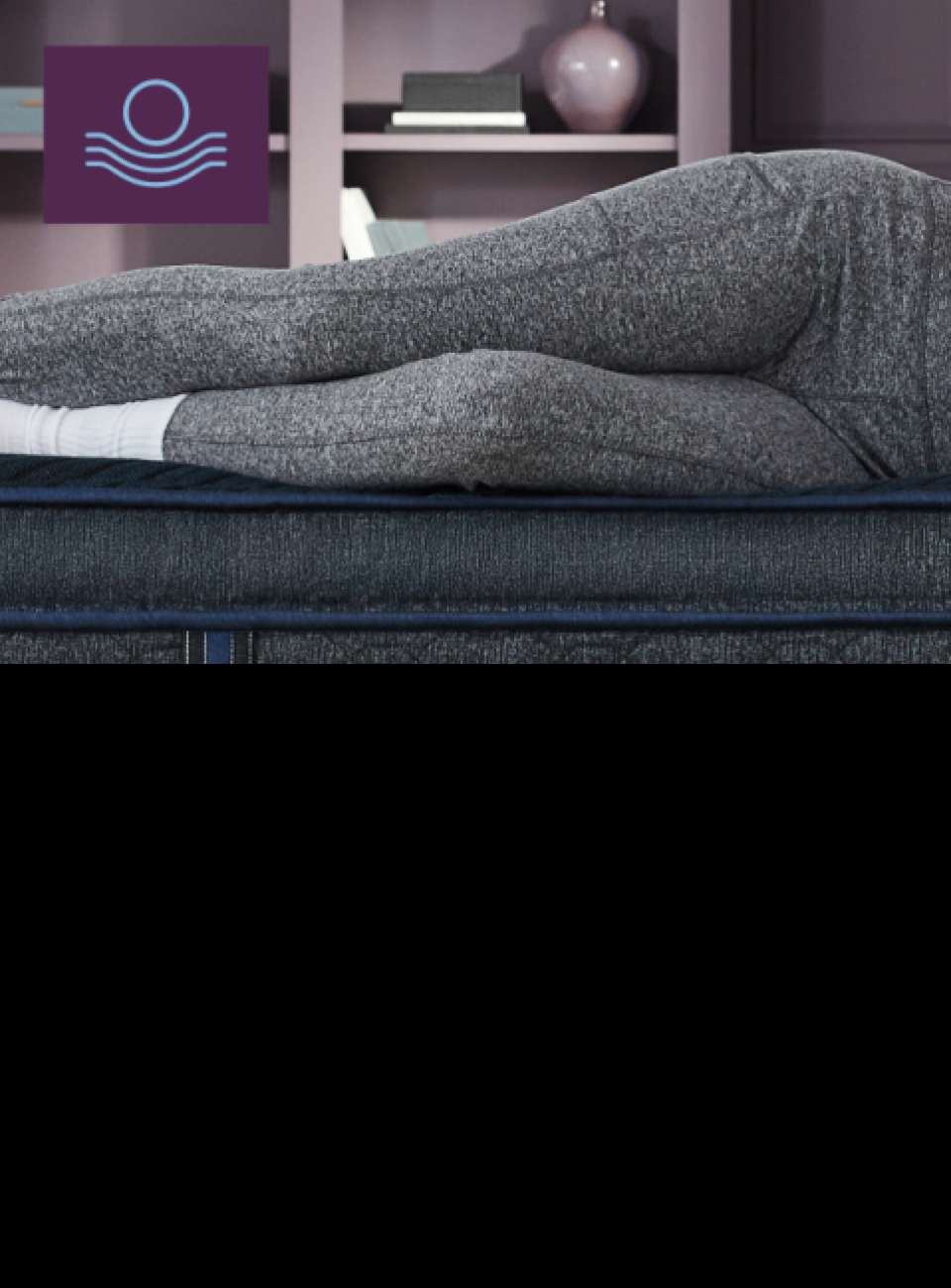 A person lying on a mattress.
