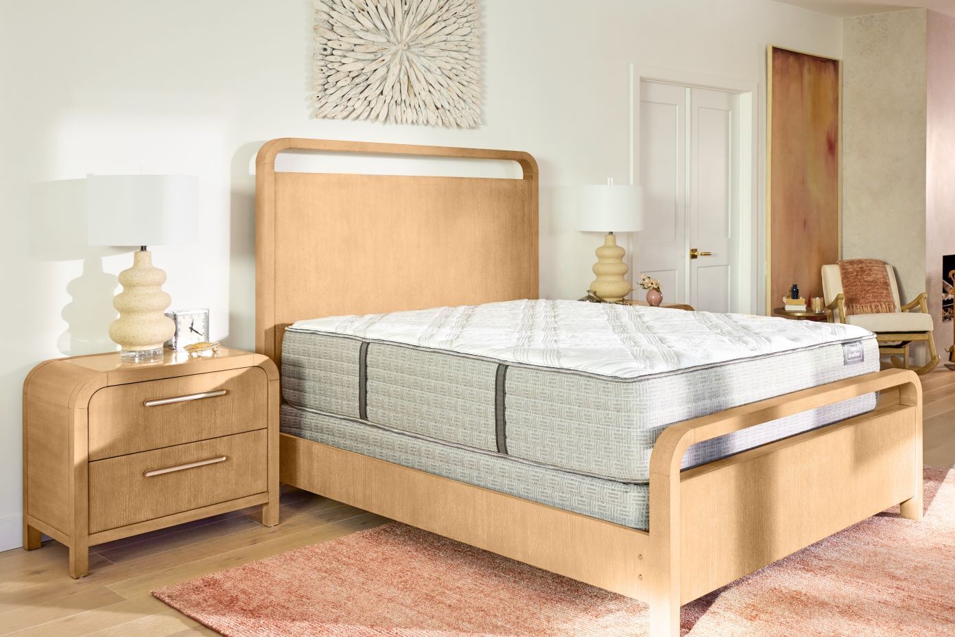 Bed with mattress and two nightstands.
