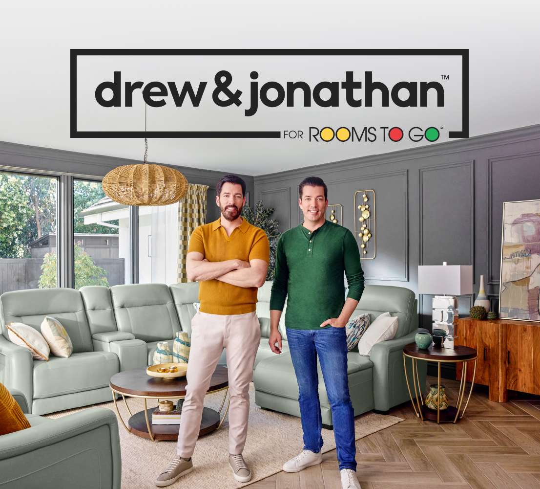 drew & jonathan for Rooms To Go. Two men standing in a living room.
