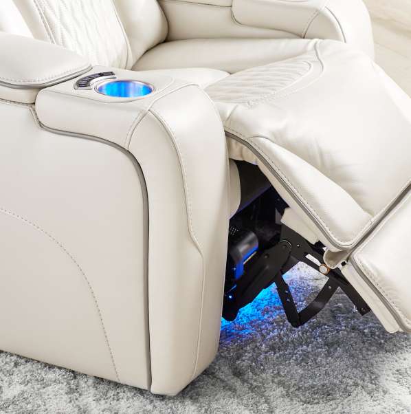 Cream-colored leather recliner with blue LED lighting.
