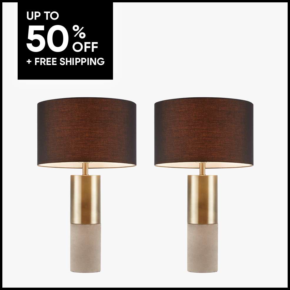 UP TO 50% OFF + FREE SHIPPING. Two modern table lamps with brown shades and gold and beige bases.

