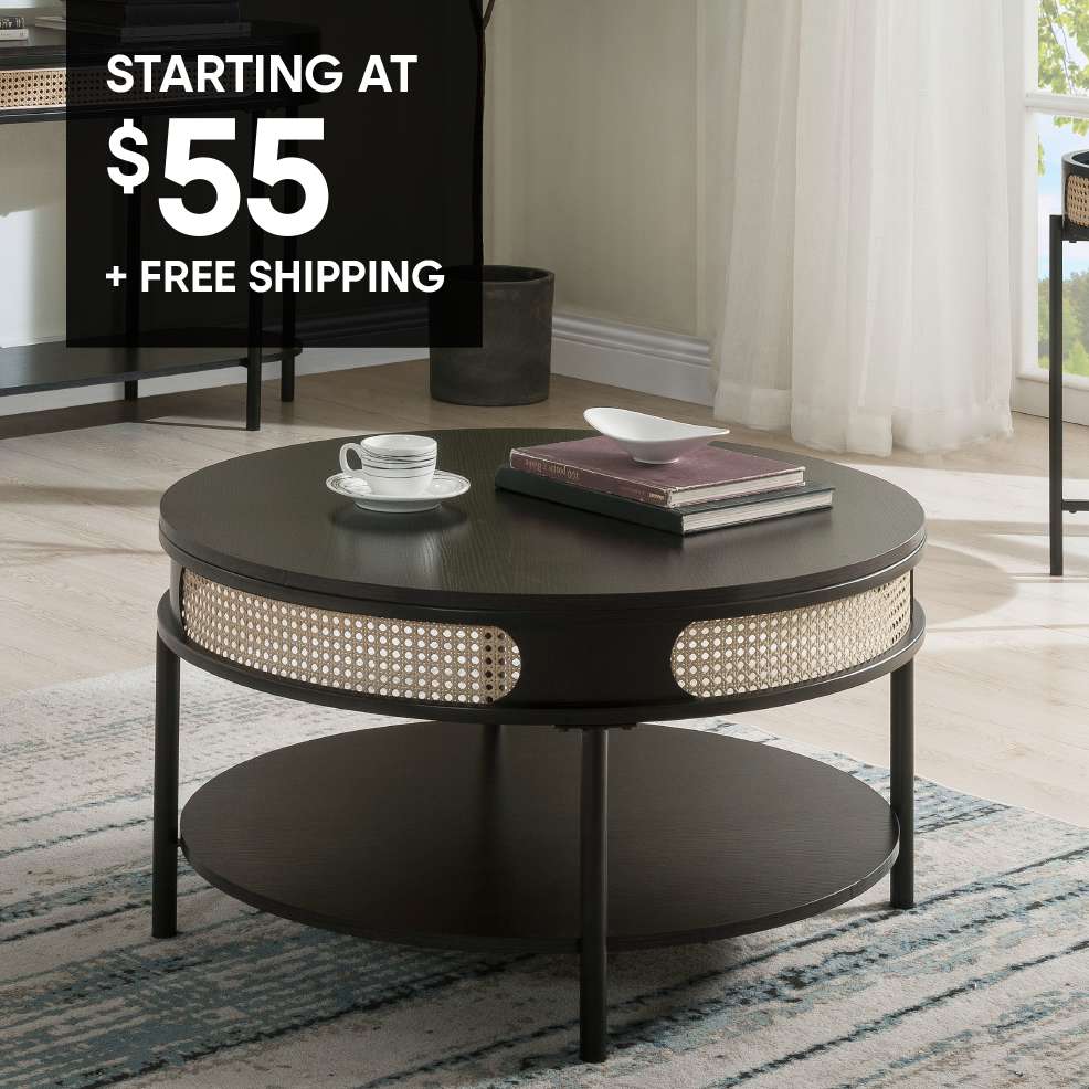 STARTING AT $55 + FREE SHIPPING. A round black coffee table with a woven cane design.
