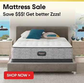 Mattress Sale: Save $$$! Get better Zzzs! Shop Now. Image of a bed with pillows and nightstands.

