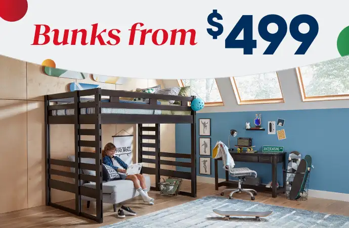 Bunks from $499. A room with a bunk bed, desk, and a child sitting on a sofa.

