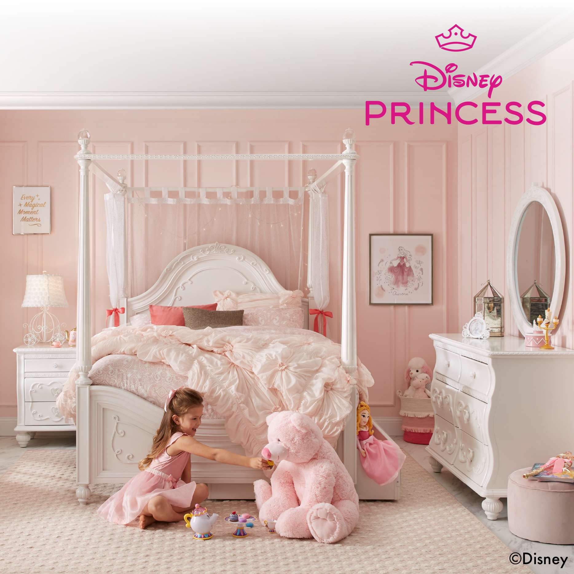 Disney Princess bedroom with a girl playing tea party with a teddy bear.
