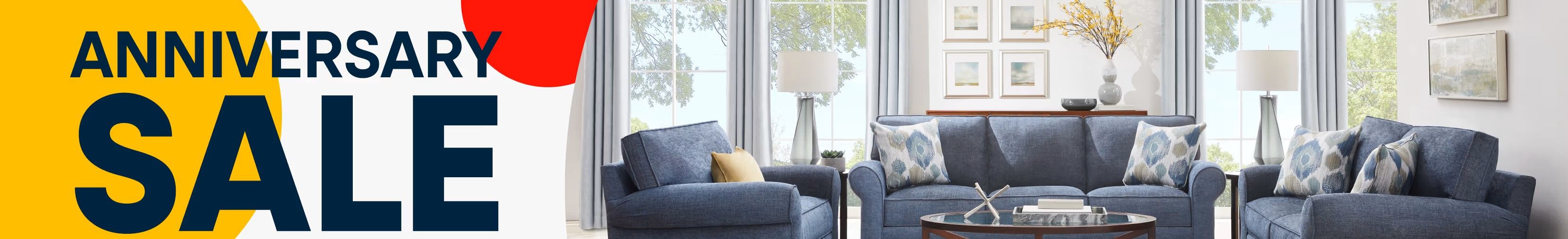 ANNIVERSARY SALE. Blue furniture in a living room.
