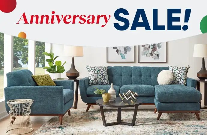 Anniversary SALE! A living room set with a teal sofa and chair.
