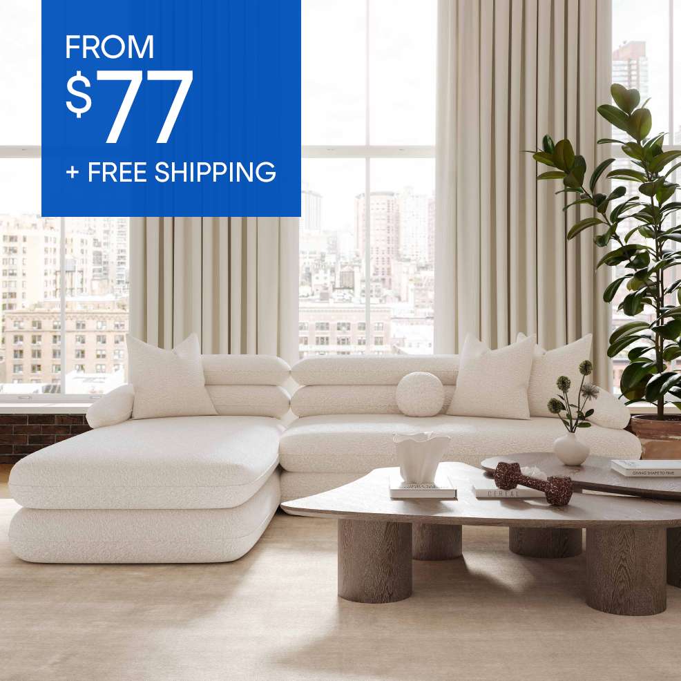 FROM $77 + FREE SHIPPING. A white sectional sofa in a modern living room.

