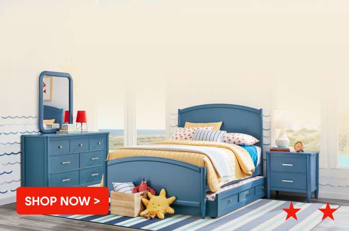 SHOP NOW > A blue bedroom set with a bed, dresser, and nightstand.
