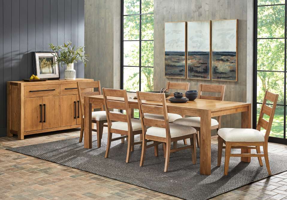 Dining room furniture set with a wooden table, chairs, and a sideboard.
